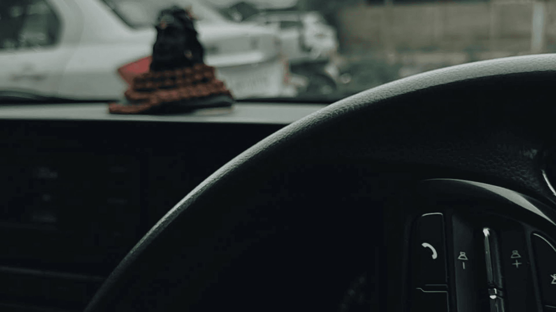 Rainy night drive with moody lighting inside car cabin