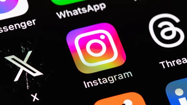 A phone with Instagram logo, dark background