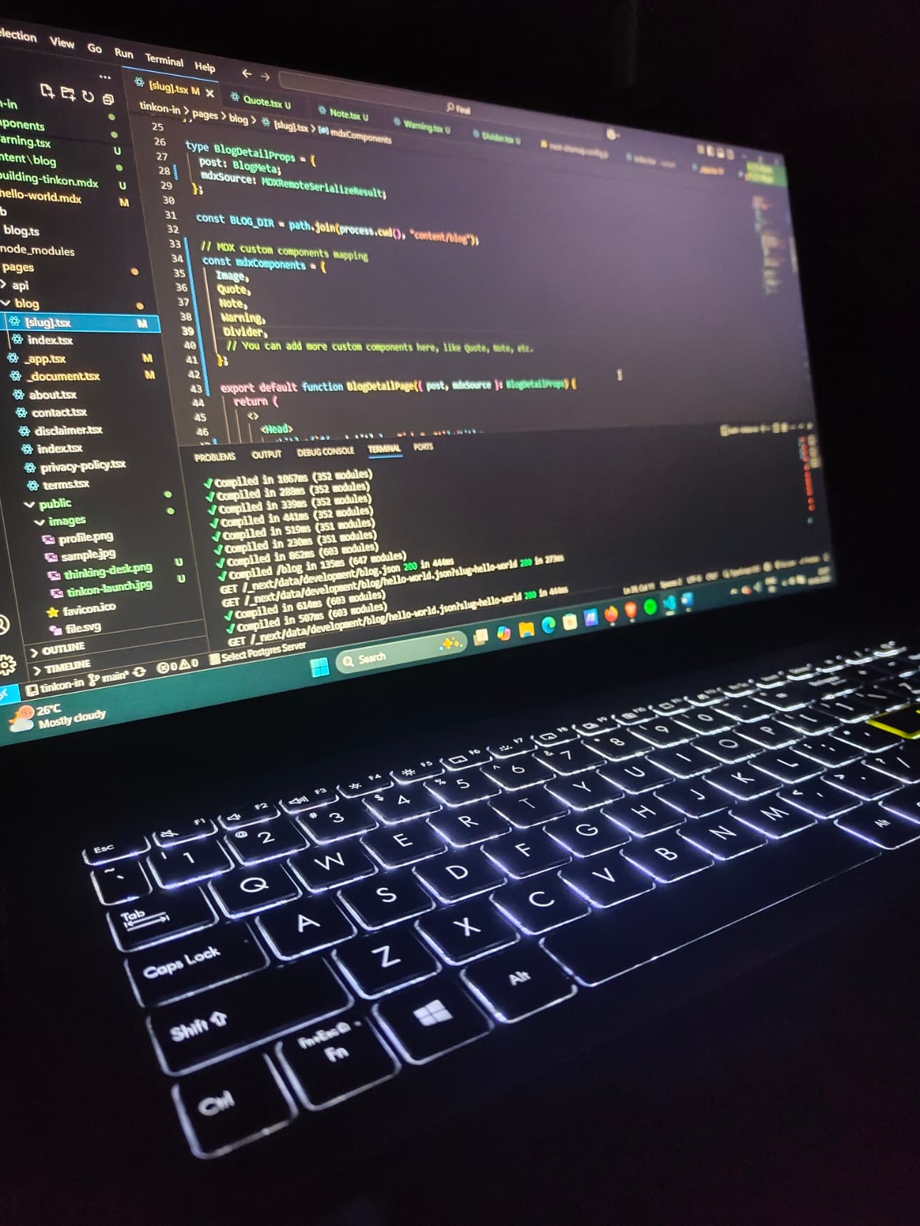 Late night with a glowing laptop screen and empty coffee mug